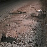 Pothole on Road at 68 Hanna St E