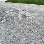 Pothole on Road at 3152 Woodlawn Ave
