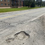 Pothole on Road at 2940 Elsmere Ave