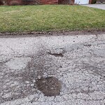 Pothole on Road at 3015 Radisson Ave