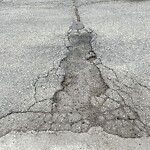 Pothole on Road at 1062 Jarvis Ave