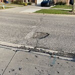 Pothole on Road at 3579 Wildwood Dr