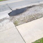 Pothole on Road at 3701 Riverside Dr E