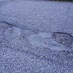 Pothole on Road at 3008 Radisson Ave