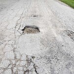 Pothole on Road at 3940 Carmichael Rd