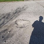 Pothole on Road at 3041 Radisson Ave