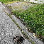 Pothole on Road at 2367 Cadillac St