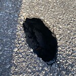 Pothole on Road at 99044 Gladstone Ave